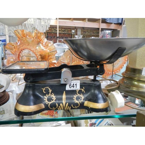 641 - A set of kitchen scales with painted cast base.