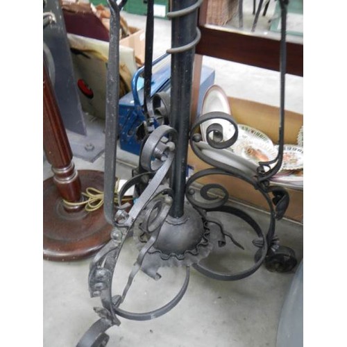 642 - A Victorian adjustable iron standard lamp complete with shade, COLLECT ONLY.