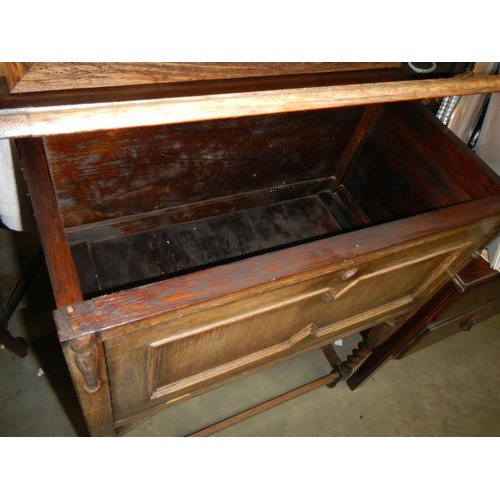 672 - An oak lift up drop front cabinet, COLLECT ONLY.