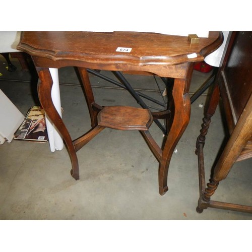 674 - A mahogany occasional table. COLLECT ONLY.