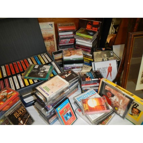 676 - A quantity of CD's, talking books etc.,