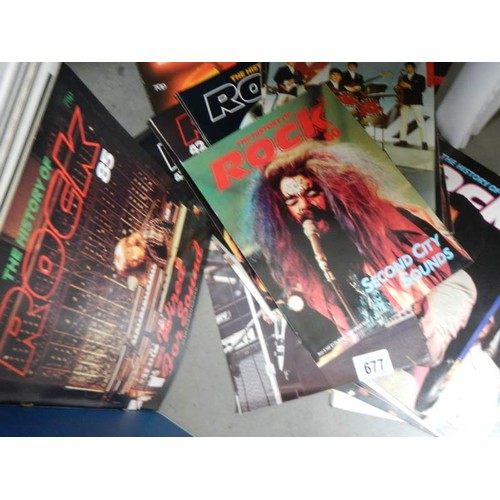 677 - A quantity of rock books etc.,