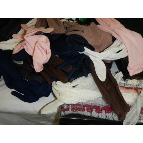 684 - A quantity of dress bags with gloves etc.,