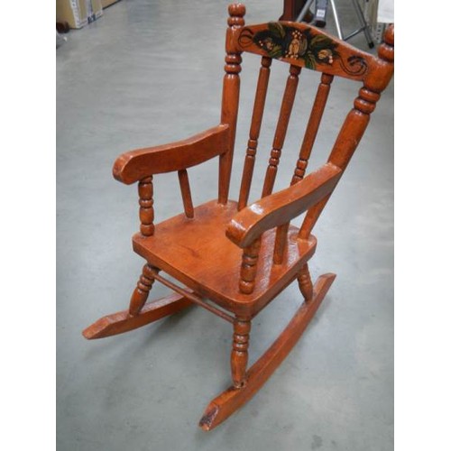 738 - A doll's rocking chair. Collect Only.