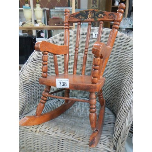 738 - A doll's rocking chair. Collect Only.