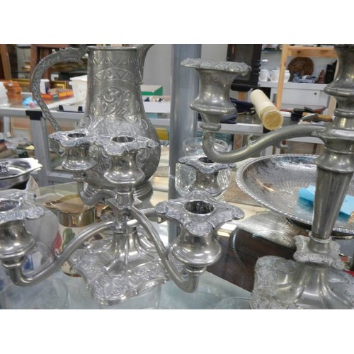 741 - A shelf of silver plate including candelabra.