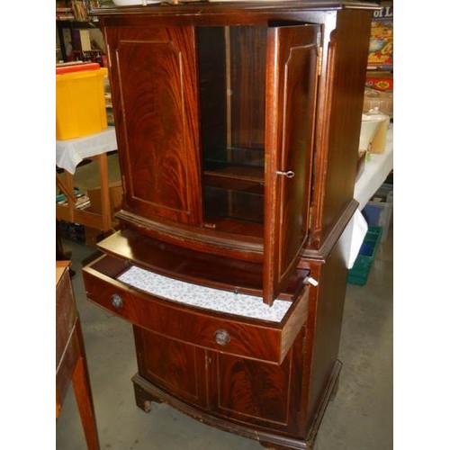 755 - A mahogany two door cabinet with draw slide, COLLECT ONLY.