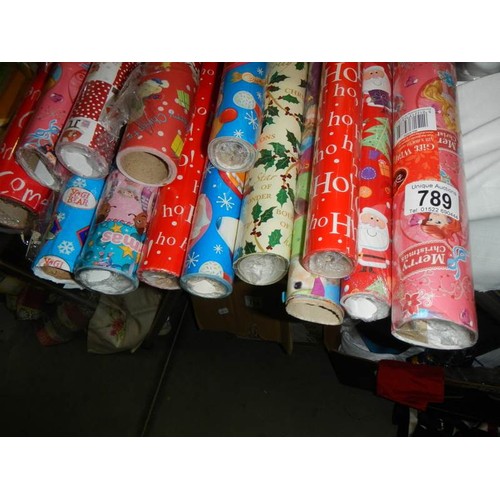 789 - Fourteen rolls of Christmas wrapping paper.