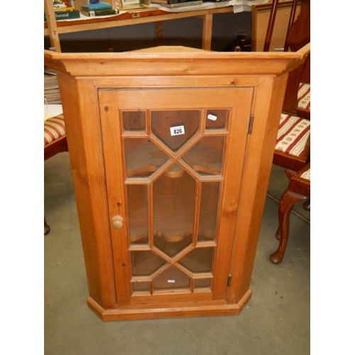 826 - An astragal glazed pine corner cabinet. COLLECT ONLY.