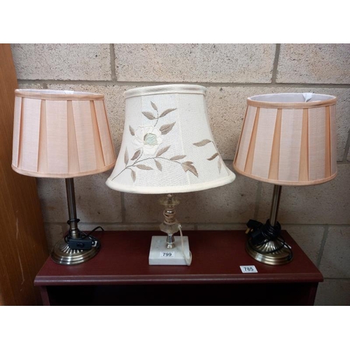 799 - A pair of metal based table lamps and one with a metal and marble base. Collect Only.