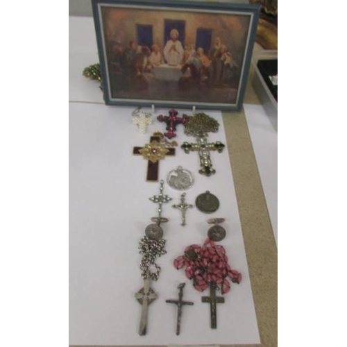 1035 - A mixed lot of cross pendants, St. Christophers etc., and a small picture of the Last Supper.