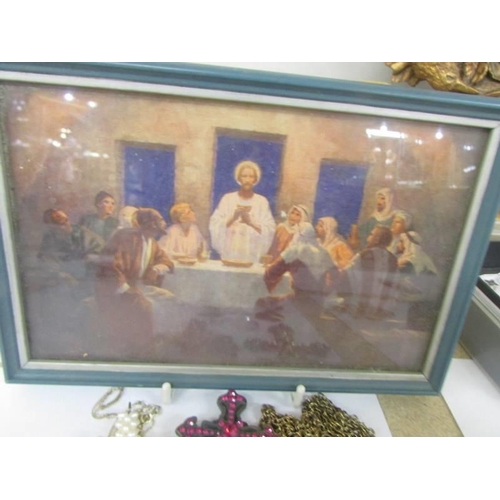 1035 - A mixed lot of cross pendants, St. Christophers etc., and a small picture of the Last Supper.