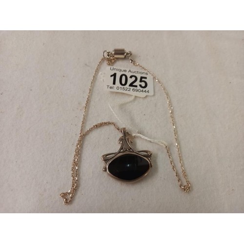 1025 - A silver and onyx art nouveau style double sided pendant.