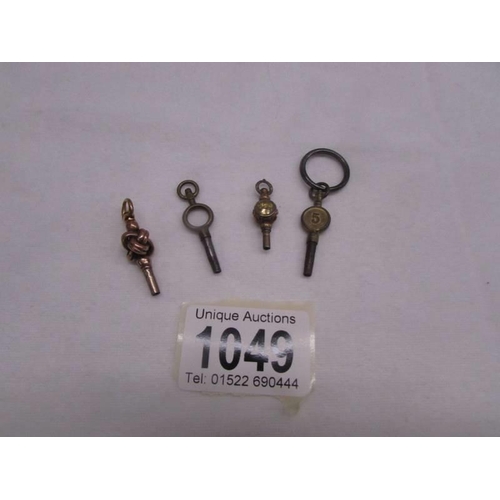 1049 - Four old pocket watch keys (one may be gold).