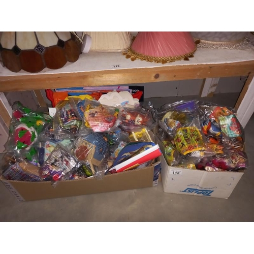 113 - A large lot of McDonalds toys still in bags, from the 90'sand 2000's, may have some complete lots in... 