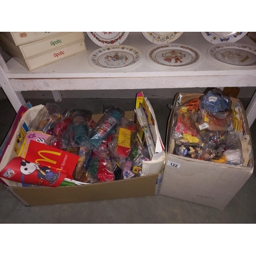 122 - A large lot of McDonalds toys still in bags, from the 90'sand 2000's, may have some complete lots in... 