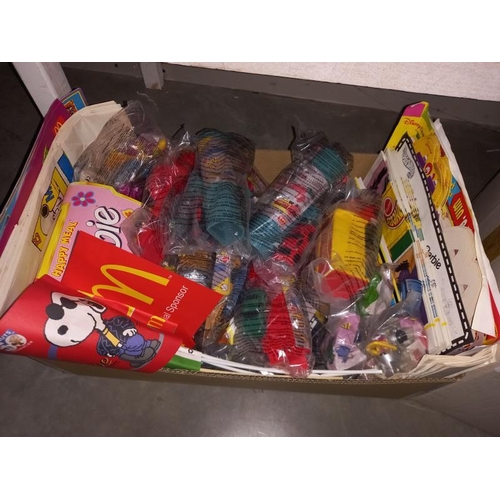 122 - A large lot of McDonalds toys still in bags, from the 90'sand 2000's, may have some complete lots in... 