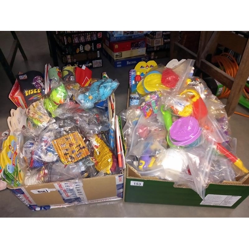 153 - A box of unopened McDonald toys including Peter Pan, Walt Disney & Smurfs etc. & a box full of opene... 