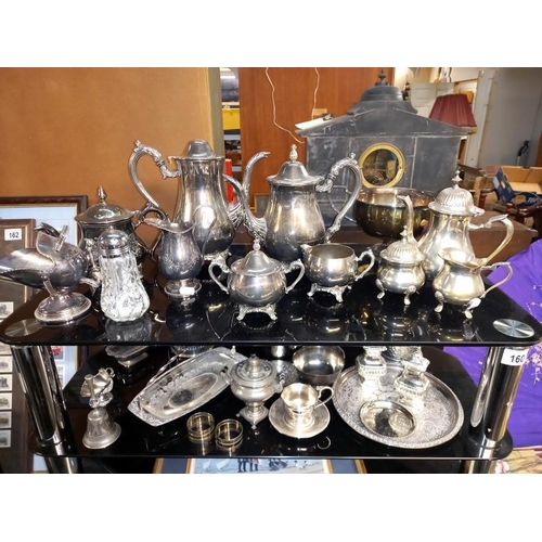 160 - 3 silver plated tea sets, small Russian samovar, cruets etc. 2 shelves