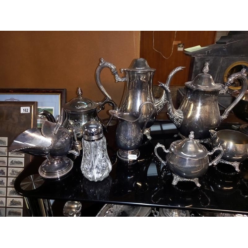 160 - 3 silver plated tea sets, small Russian samovar, cruets etc. 2 shelves