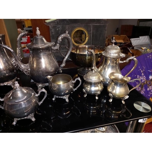 160 - 3 silver plated tea sets, small Russian samovar, cruets etc. 2 shelves