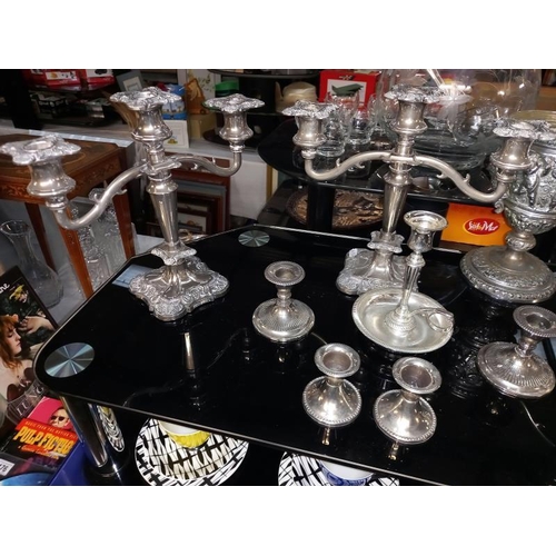 173 - 3 Silver plated candelabras and a 2 pairs of dwarf candlesticks