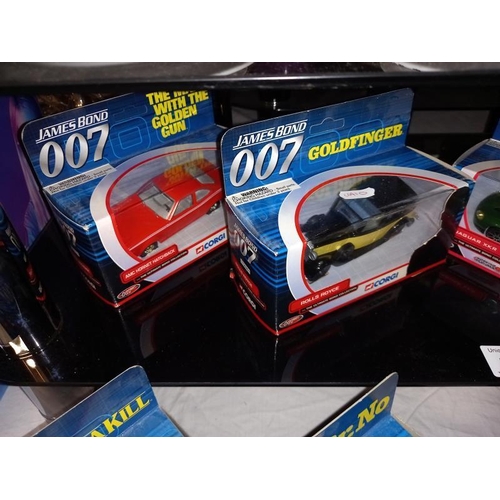 175 - 9 Corgi Diecast James Bond cars, Rolls Royce, Jaguar, Sunbeam Alpine, etc