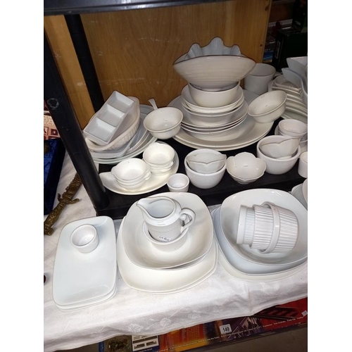 182 - A large selection of white glazed dinner/table ware.