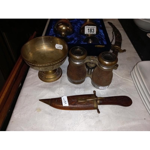 183 - 4 cased brass goblets, brass ceremonial daggers, old binoculars etc