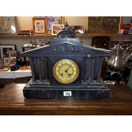 192 - A black slate mantle clock with 6 brass reeded columns, no key, no pendulum, 1 spring broken 1 over ... 