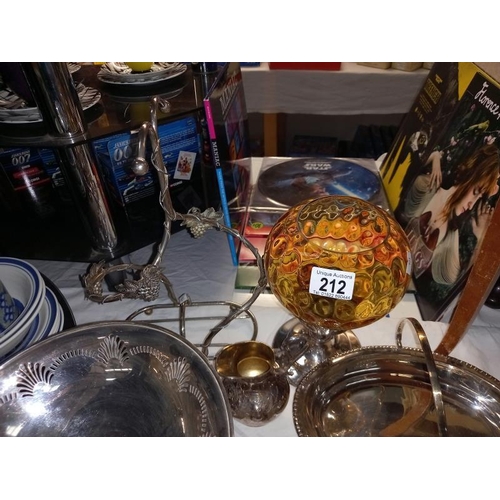 212 - A good selection of silver plate including tureen, bottle stand and candle lamp with amber glass sta... 