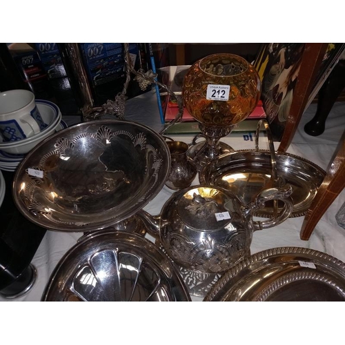 212 - A good selection of silver plate including tureen, bottle stand and candle lamp with amber glass sta... 