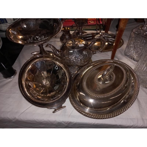 212 - A good selection of silver plate including tureen, bottle stand and candle lamp with amber glass sta... 