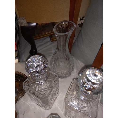 213 - 4 cut glass decanters including Royal Doulton, including a vase.