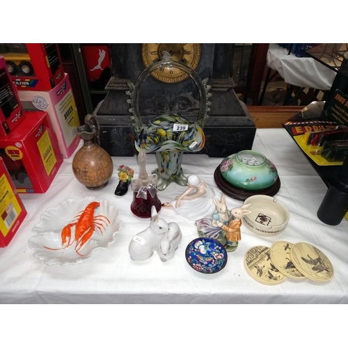 239 - A mixed lot including glass, basket, figures, etc.