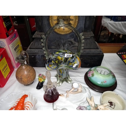 239 - A mixed lot including glass, basket, figures, etc.