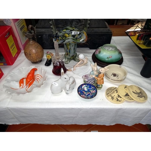 239 - A mixed lot including glass, basket, figures, etc.