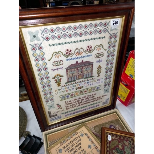 246 - A large framed sampler dated 2004 and 3 others.