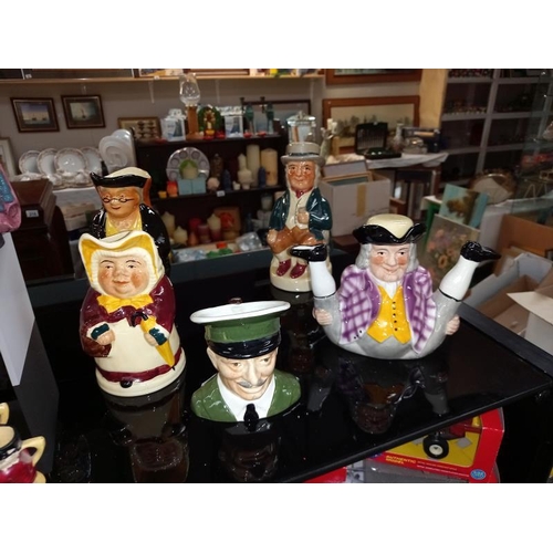 252 - 10 Character/Toby jugs, including Royal Doulton, Carlton ware, etc.