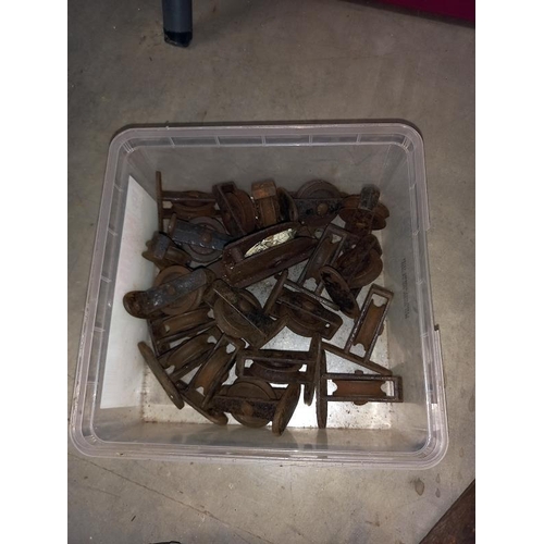 292 - A quantity of vintage sash window pulley wheels & brass plated hooks etc.