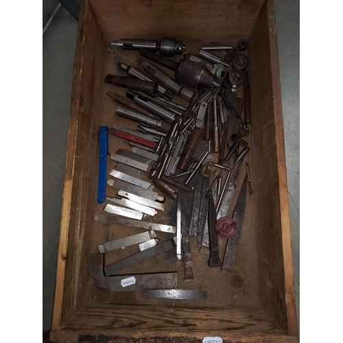 294 - A box of machine tools including taps, etc.