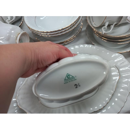 304 - A Chodziez made in Poland, white dinner service with gilded rims.