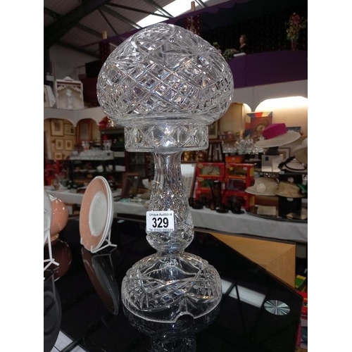 329 - A 1930's heavy cut glass table lamp. Height 35cm.
Small nibble on base and few flea bite nibble to b... 