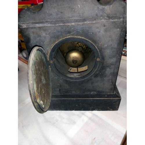 340 - A black slate mantle clock with marble columns, no key, no pendulum, both springs ok, missing finger