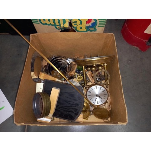 617 - A box of clock parts.