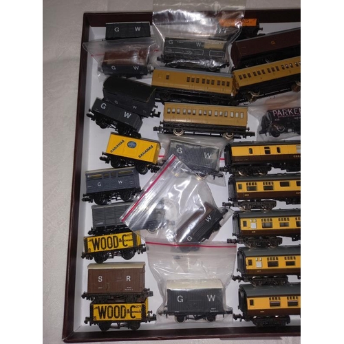 355 - A quantity of gauge goods wagons and coaches including Farish etc.