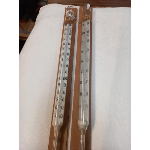 397 - 2 vintage Mercury filled glass alcohol measure thermometers. 76cm Length. Collect Only.