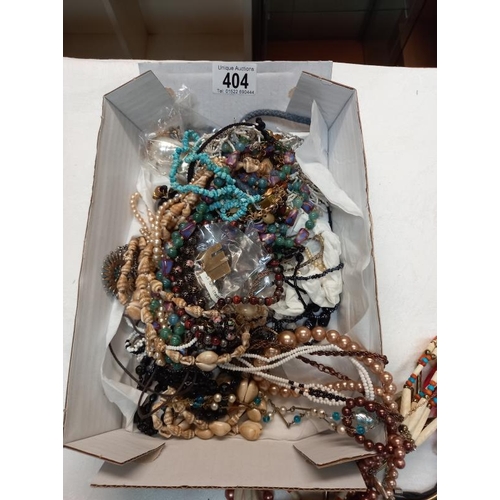 404 - A box of costume jewellery.