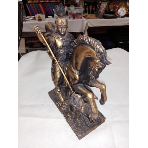 428 - A bronzed resin figure of George and the Dragon and figure of Napoleon.