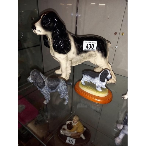 430 - A quantity of Cocker Spaniel dog ornaments. Pottery and resin.